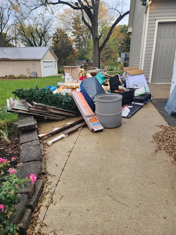Dumpster being loaded with debris for Roofing Dumpster Rental in West Pottsgrove
